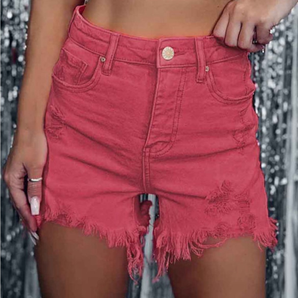 Red distressed denim shorts